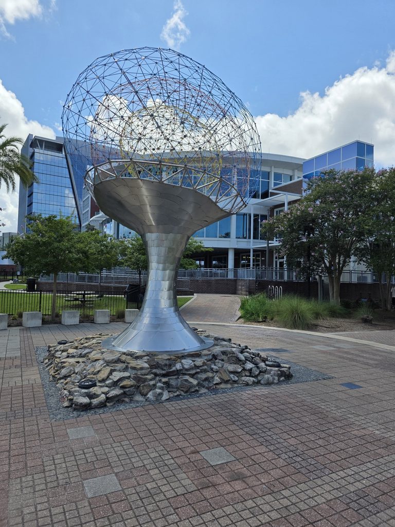 The Tillie K. Fowler Memorial "The Brain Sculpture" along the North bank Riverwalk in Jacksonville, FL. The Winston Family YMCA in the background.